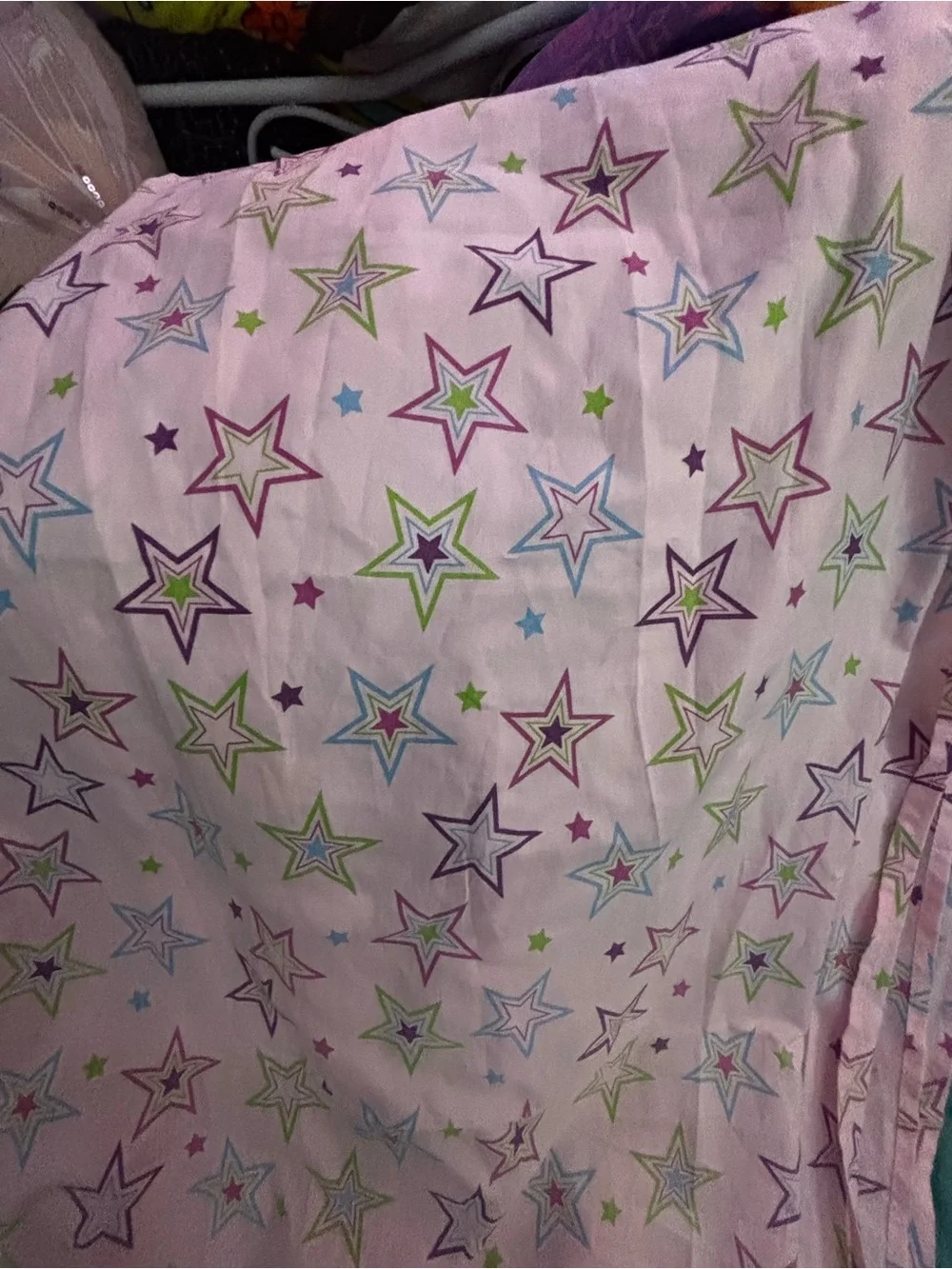 Pink bedsheet with multicolored stars